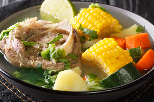Delicious Mexican beef soup with vegetables close-up in a bowl on the table. horizontal