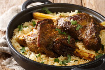 Haneeth is a traditional Yemeni dish also trendy in the rest of the Arabian Peninsula closeup on the table. horizontal