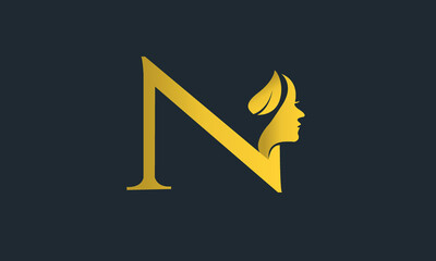 N logo with lady face with golden color