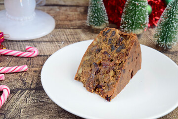 Traditional Christmas Cake with Dried Fruits and Nuts. Slice of Fruit Cake