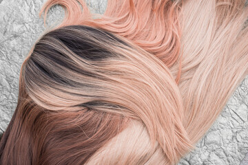 Wigs, natural and synthetic hair. Women's beauty concept. Close up photo of wig, hair for ladies