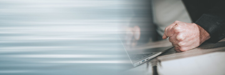 Angry businessman at his workplace; panoramic banner
