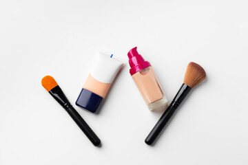 Make up liquid foundation with brush on white background
