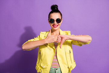 Photo of positive girl show thumb up down opinion disagree accept isolated over violet color background