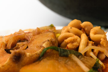 Cooking fish broth on a white background