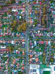 Panoramic Aerial View of Sydney Western suburbs showing house roof tops roads cars and other buildings 