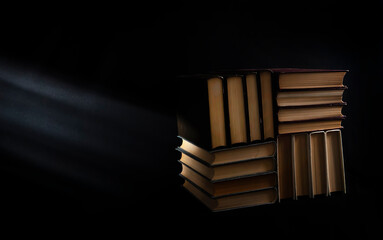 stack of books on black