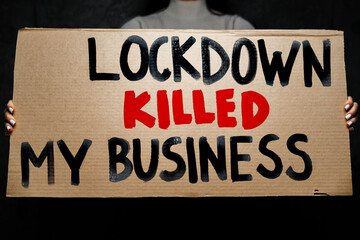 Protestive placard against coronavirus lockdowns against grey background