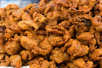 Crispy Fried Chicken Skin made by chicken skin mixes with salt, then fried its until yellow as snack.