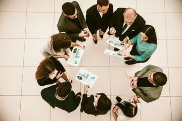 Fototapeta na wymiar top view. group of corporate employees standing in a circle.