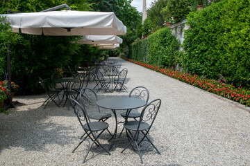 An outside cafe, summer terrace, empty tables and place
