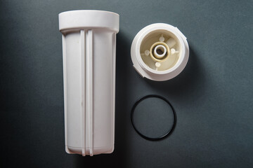 A used flask from a water purification system, on a black background, top view