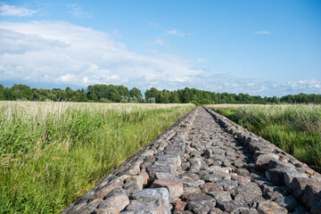 Fototapeta na wymiar View of ancient cobblestone pier in Latvia