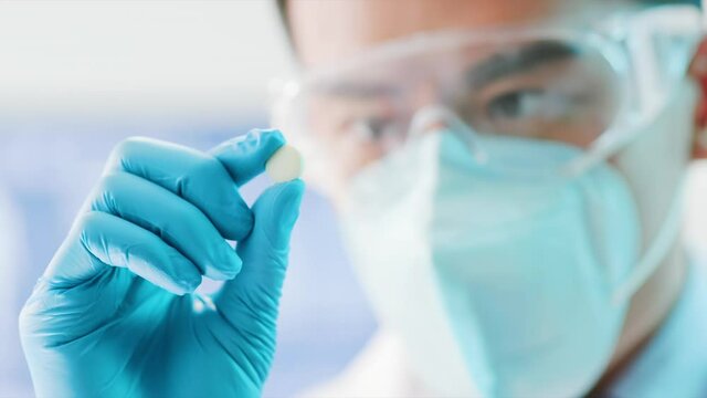 doctor look medicine capsule