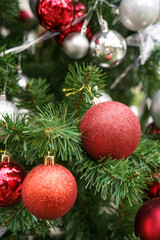 Christmas decorations on Christmas tree with Christmas balls.