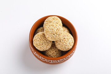 Indian sweet for traditional festival makar sankranti :Rajgira laddu made from Amaranth seed in Bowl on white background