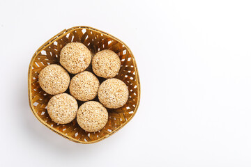 Indian sweet for traditional festival makar sankranti :Rajgira laddu made from Amaranth seed in Bowl on white background