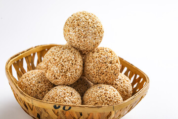 Indian sweet for traditional festival makar sankranti :Rajgira laddu made from Amaranth seed in Bowl on white background