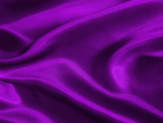 Shiny purple crumpled fabric texture. Elegant wavy cloth background