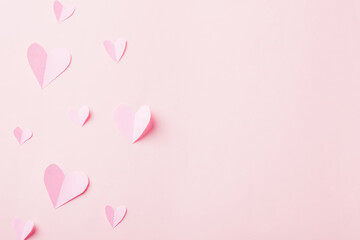 Valentines' day background. Pattern beautiful pink paper hearts cut composition greeting gift card isolated on pink background with copy space, Symbol of love Top View from above