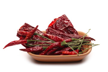 Dried spicy red peppers, dry paprika in bowl isolated on white background