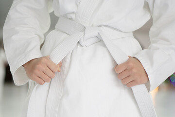 Aikido teenager  white belt on white kimono.