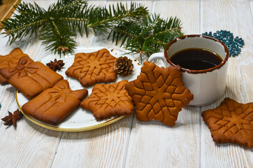 New Year's atmosphere, Christmas mood and coziness, warming winter coffee drink, relaxation at home on holiday, snowflake-shaped cookies, holiday baked goods