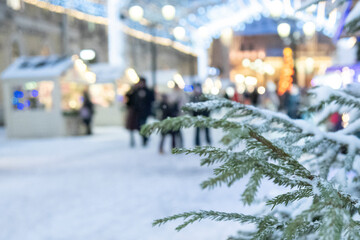 Obraz premium Traditional Christmas fair at Manezhnaya Square. Beautiful decorations, tree, lights, carousels, ice rink and Xmas market trade in city center.