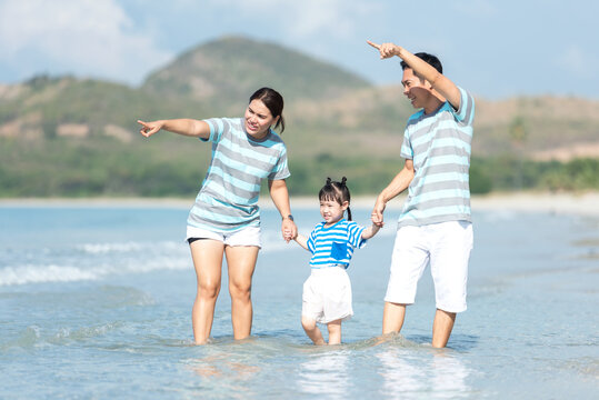 Happy family summer sea beach vacation. Asia young people lifestyle travel enjoy fun and relax leisure destination in holiday. 