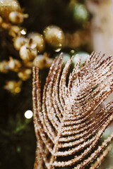 Christmas tree branches decorated with golden flowers. New Year's composition. Christmas tree branches on a white background . Christmas, winter, new 2021 year concept. Christmas still life.