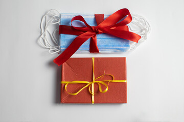 The masks are wrapped in a red ribbon with a gift. Valentine's day.
