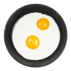 top view of fried eggs in black round pan isolated