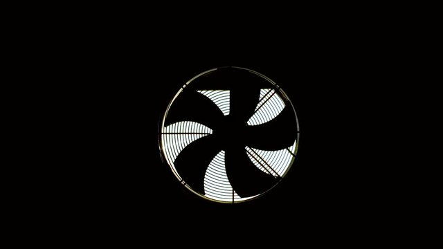 A hood with a fan is installed in a dark room. The blades are spinning