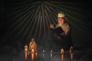 muslim man with gray beard reading islam holy quran book