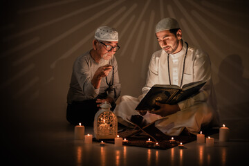 two muslim people study islam quran book together during ramadan