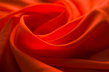 Luxurious satin red silk or fabric. soft waves cloth abstract background. 