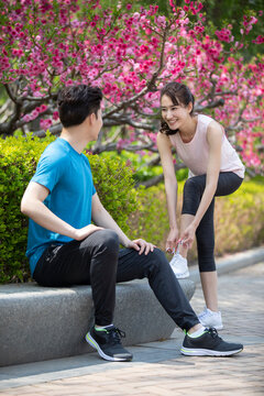 Happy young couple preparing for morning run