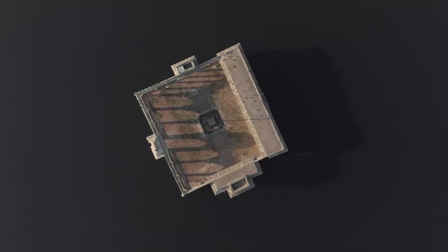 Bird's eye view of Mohan Mandir Temple in Pichola Lake, in Rajasthan, India - Aerial Rocket shot