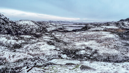 Arctic winter panoramic view of the snow-covered valley and hills on the Kola Peninsula.