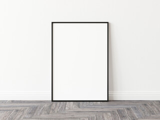 Blank vertically oriented rectangular picture frame with thin black border standing on wooden parquet floor leaning on white wall. 3D Illustration. - obrazy, fototapety, plakaty