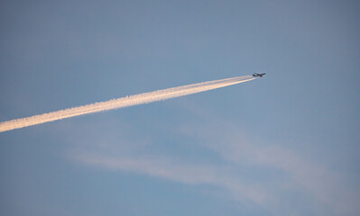 Jet of airplane at the sky