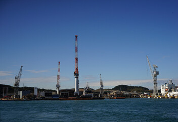 Fototapeta na wymiar Large industrial port cranes in Shimonoseki, Yamaguchi, Japan - 山口 下関 工業用クレーン