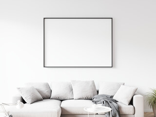 Horizontally oriented rectangular picture frame with thin black border hanging on white wall above sofa in living room. 3D illustration.