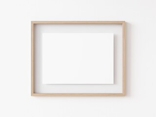 Empty horizontally oriented rectangular light wood picture frame hanging on white wall. 3D Illustration.