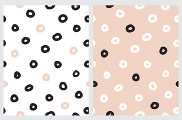 Seamless Hand Drawn Vector Pattern with Pale Pink, White and Black Irregular Circles Isolated on a Light Dusty Pink and White Background. Cute Abstract Doodle Print ideal for Fabric, Textile.