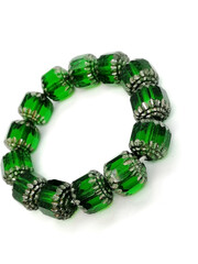 Bracelet made of green beads on a white background. Close-up