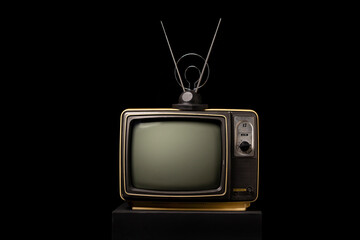 Retro old TV with antenna on black background