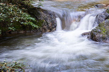 Fototapeta premium Waterfall in forest at Chae Son Nation park, Northern, Thailand.