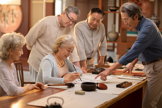 Happy friends drawing Chinese painting together