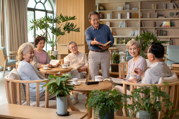 Senior adult discussing a book in book club